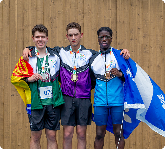Athletes holdig flags standing shoulder to shoulder